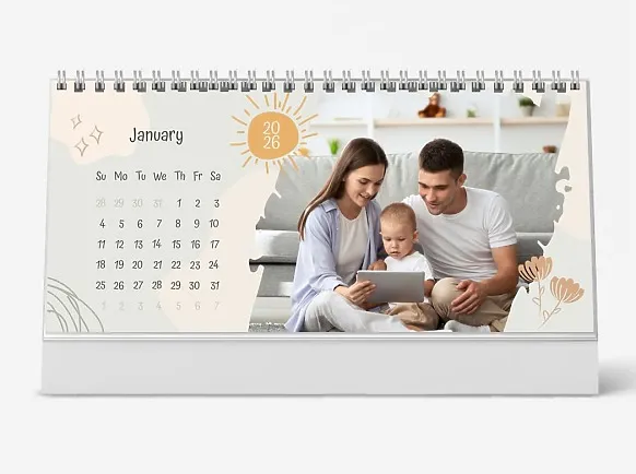 A desk calendar template for a young and happy family with a small child, featuring pastel-colored illustrations for toddlers.