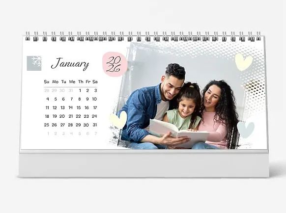 Desk calendar template: "A young and happy family with a daughter in their home"