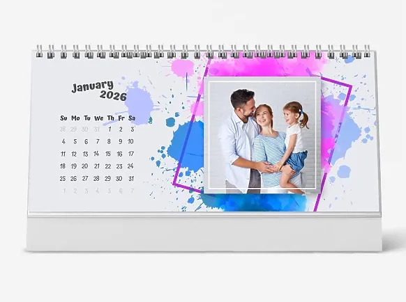 A desk calendar template featuring young parents and their little daughter against a white brick wall.
