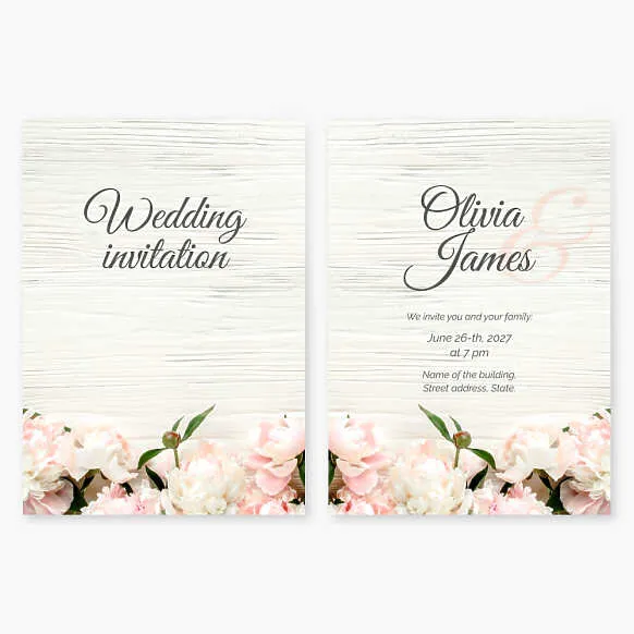 Wedding invitation with peony flowers on a wooden background